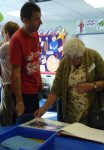 A vistor looks at a display book